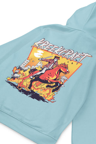 KreekCraft seafoam hoodie with KreekCraft riding a horse in a burning city artwork on the entire back, in close-up.