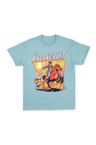 KreekCraft seafoam tee with KreekCraft riding a horse in a burning city artwork on the entire front.