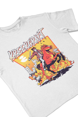 KreekCraft white tee with KreekCraft riding a horse in a burning city artwork on the entire front, in close-up.