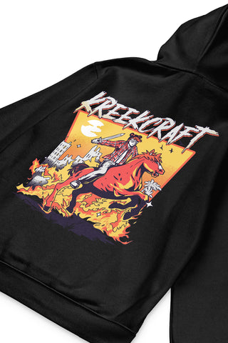 KreekCraft black hoodie with KreekCraft riding a horse in a burning city artwork on the entire back, in close-up.